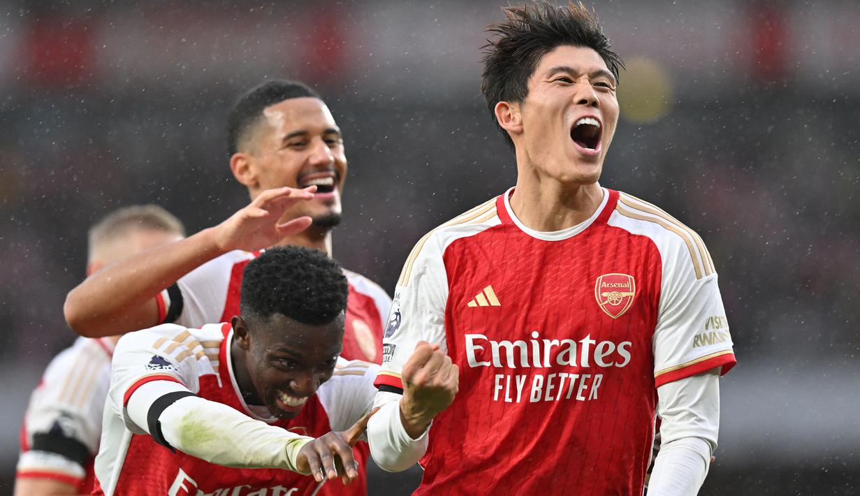 Di balik kehebatan Arsenal asuhan Mikel Arteta dalam beberapa musim terakhir di Liga Inggris, terdapat sosok pesepak bola asal Jepang, Takehiro Tomiyasu yang manjadi andalan di lini belakang The Gunners. Jauh sebelum memutuskan hijrah ke Eropa, pesepak bola kelahiran Fukuoka 25 tahun lalu ini merupakan alumnus J.League bersama Avispa Fukuoka. (AFP/Glyn Kirk)