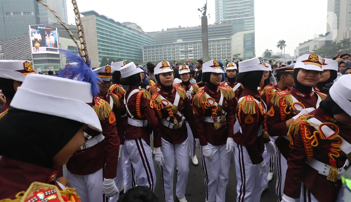 Polisi Cilik bersiap melakukan aksi baris-berbaris  saat CFD di kawasan Budaran HI, Jakarta, Minggu (3/7/2022). Aksi ini dalam rangka memeriahkan HUT ke-76 Bhayangkara. (Liputan6.com/Angga Yuniar)