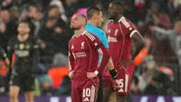 Pemain Liverpool Alexis Mac Allister bereaksi setelah timnya kebobolan pada laga leg kedua perempat final Liga Champions antara Liverpool vs PSG di Liverpool, Inggris, Selasa, 14 April 2026. (AP Photo/Dave Shopland)