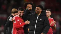 Selebrasi pemain Manchester United saat menang super dramatis atas Lyon di Liga Europa. (Oli SCARFF / AFP)
