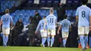 Pemain Manchester City meninggalkan lapangan pada akhir pertandingan melawan Manchester United pada pertandingan Liga Inggris di Etihad Stadium, Manchester, Inggris, Minggu (7/3/2021). Manchester United mempermalukan Manchester City dengan skor 2-0. (Peter Powell/Pool via AP)