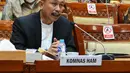 Ketua Komnas HAM Ahmad Taufan Damanik mengikuti Rapat Dengar Pendapat (RDP) dengan Komisi III di Kompleks Parlemen, Senayan, Jakarta, Selasa (6/4/2021). Rapat membahas instrument perundang-undangan terkait HAM serta evaluasi kinerja. terakhir. (Liputan6.com/Angga Yuniar)