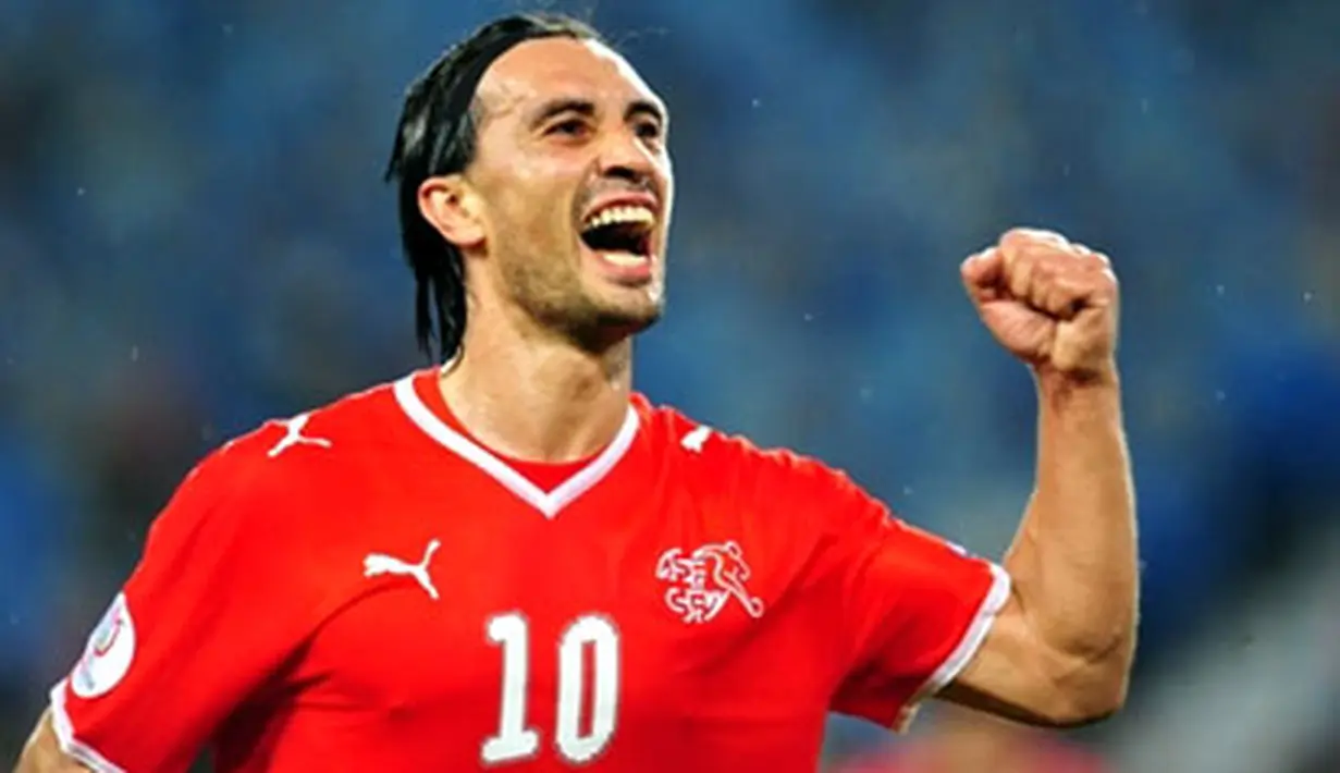 Swiss midfielder Hakan Yakin jubilates after scoring a goal during the Euro 2008 Championships Group A football match Switzerland vs. Portugal on June 15, 2008 at Jakob-Park stadium in Basel. AFP PHOTO / DANIEL MIHAILESCU