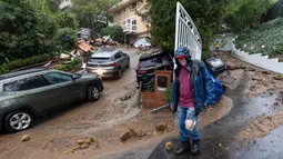 Badai sungai atmosfer (atmospheric river storm) kedua yang lebih kuat dilaporkan tengah menuju California Selatan akhir pekan ini. (DAVID MCNEW/AFP)