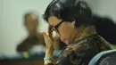 Saat mendengarkan hakim, Sri Mulyani memegang dahinya ketika menjadi saksi di Pengadilan Tipikor Jakarta, Jumat (2/5/2014) (Liputan6.com/Johan Tallo).