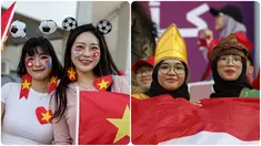 Gaya suporter Timnas Indonesia dan Vietnam pada pertandingan sepak bola Grup D Piala Asia 2023 antara Vietnam dan Indonesia di Stadion Abdullah bin Khalifa, Doha, Qatar, Jumat (19/1/2024). (KARIM JAAFAR/AFP)