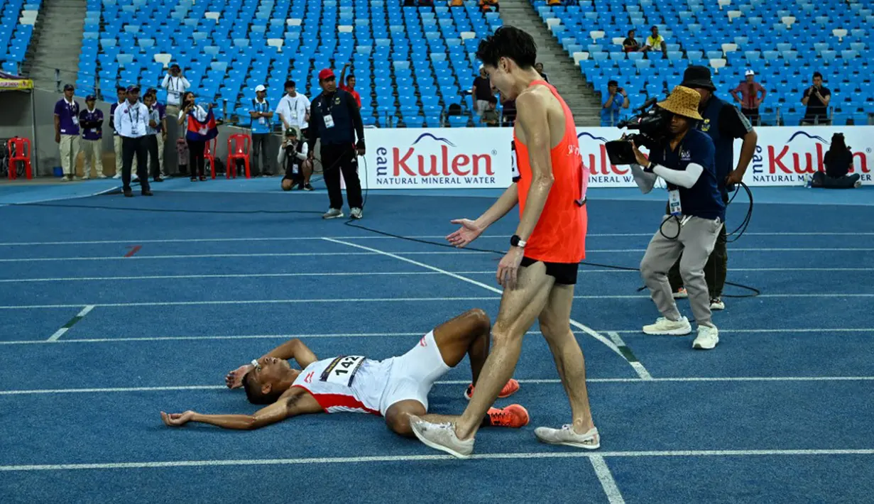 Kemenangan ini merupakan hasil memuaskan yang berhasil diraih Rikki Marthin. Indonesia pun kini terus menambah perolehan medalinya di papan klasemen. (MOHD RASFAN/AFP)