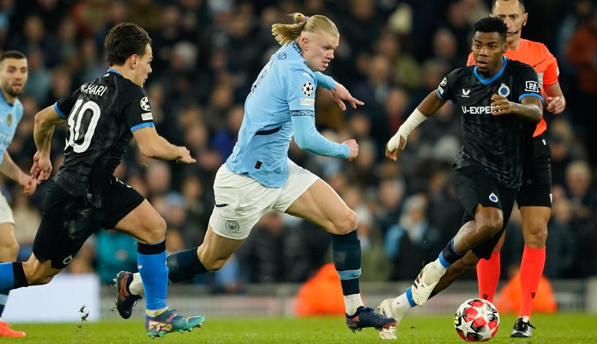 Manchester City sukses melaju ke babak play-off Liga Champions setelah mencatat kemenangan dramatis melawan Club Brugge di Etihad Stadium. City menang dengan skor 3-1. (AP Photo/Dave Thompson)