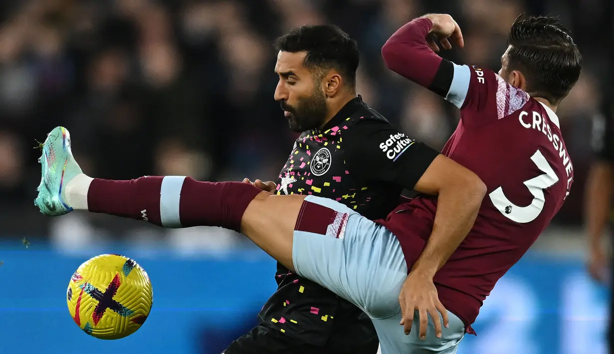 Gelandang serang Brentford, Saman Ghoddos akan memperkuat Timnas Iran di Piala Asia 2023 yang menjadi edisi keduanya di Piala Asia setelah sebelumnya juga masuk skuad Iran pada Piala Asia 2019. Bersama Timnas Iran ia telah mengoleksi 40 caps dengan torehan 2 gol dan 5 assist sejak melakukan debut pada 5 Oktober 2017. (AFP/Ben Stansall)