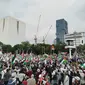 Ribuan orang menggelar Aksi Bela Palestina di Patung Kuda Arjuna Wiwaha, Jakarta Pusat pada Minggu (9/6/2024) dan panitia juga menggalang donasi. (Liputan6.com/Ady Anugrahadi)