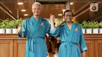 Bakal pasangan calon presiden dan wakil presiden Ganjar Pranowo-Mahfud MD menyapa awak media sesaat sebelum menjalani tes kesehatan di RSPAD Gatot Soebroto, Senen, Jakarta Pusat, Minggu (22/10/2023). (Liputan6.com/Herman Zakharia)