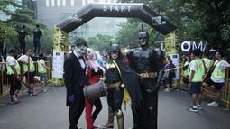 Para pelari berpose saat mengikuti Batman Run Series di Jakarta Barat, Minggu (1/12). Acara ini merupakan kerjasama antara Indofunrun dengan Lippo Mall Puri. (Dokumentasi Indofunrun)