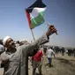 Warga Palestina di Gaza melakukan protes dalam peringatan 71 tahun hari "Nakba" atau malapetaka akibat berdirinya negara Israel di sana, Rabu (15/5/2019). (AP)