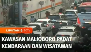Libur panjang akhir pekan, kawasan Malioboro, Yogyakarta, dipadati wisatawan. Keramaian wisatawan membuat jalan di sepanjang Malioboro macet.