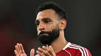 Tangis Mohamed Salah pecah mengenang Diogo Jota selepas laga Liverpool vs Bournemouth pada pekan 1 Premier League 2025/2026, Sabtu (16/8/2025) dini hari WIB. (Paul ELLIS / AFP)