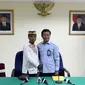 Mualimin Abdi telah mencabut gugatan dan memaafkan Budi Imam, pemilik laundry yang membuat rusak jas kesayangannya. (Via: liputan6.com/Helmi Afandi)