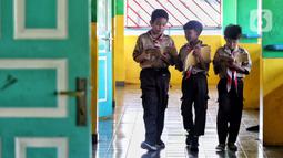 Dalam putusannya, MK menyatakan, frasa "wajib belajar minimal pada jenjang pendidikan dasar tanpa memungut biaya" dalam Pasal 34 ayat (2) UU Sisdiknas telah menimbulkan multitafsir. (Liputan6.com/Angga Yuniar)