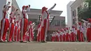 Sejumlah calon anggota Pasukan Pengibar Bendera (Paskibra) Nasional 2019 meneriakkan yel usai mengikuti latihan di PPPON Cibubur, Jakarta, Selasa (30/7/2019). Saat ini, 68 orang anggota Paskibraka nasional 2019 sedang menjalani pendidikan dan pelatihan intensif. (Liputan6.com/Herman Zakharia)