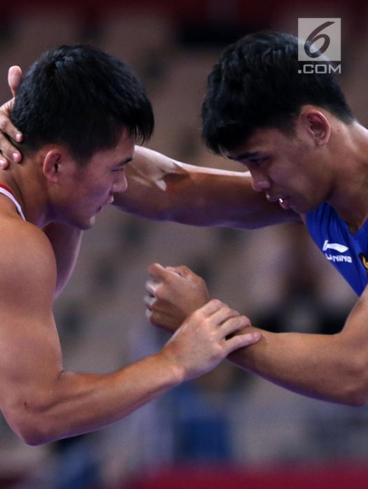 Pada perdelapan final, Muhammad Aliansyah menang atas lawanya dengan skor 2 - 2 dan masuk perempat final. (Liputan6.com/Fery Pradolo)