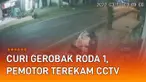 Aksi seorang pemotor curi gerobak roda 1 di pinggir jalan mengundang perhatian