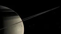 Bulan milik planet Saturnus, Tethys, memperlihatkan permukaan yang dipenuhi jejak bercak merah seperti darah