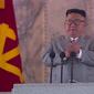 Kim Jong-un menangis terharu dalam parade militer yang menampilkan rudal baru Korea Utara pada 10 Oktober 2020 (AFP)