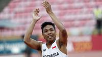 Sprinter Indonesia, Lalu Muhammad Zohri merayakan kemenangan pada final 100 meter Putra IAAF World Junior Championships 2018 di Tampere, Finlandia, (11/7/2018). (AFP/Lehtikuva/Kalle Parkkinen/Finland OUT)