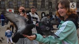 De Dam Square, atau biasa disebut 'Dam', adalah alun-alun sentral Amsterdam yang memiliki nilai historis dan kultural yang sangat penting bagi Belanda. (merdeka.com/Arie Basuki)