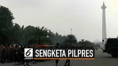 Ribuang personel bersiaga di kawasan Monas Jakarta Pusat. Mereka mengantisipasi pendemo yang akan mendatangi MK saat sidang sengketa Pilpres. Polisi juga mulai mengalihkan lalu lintas yang menuju jalan Merdeka Barat.