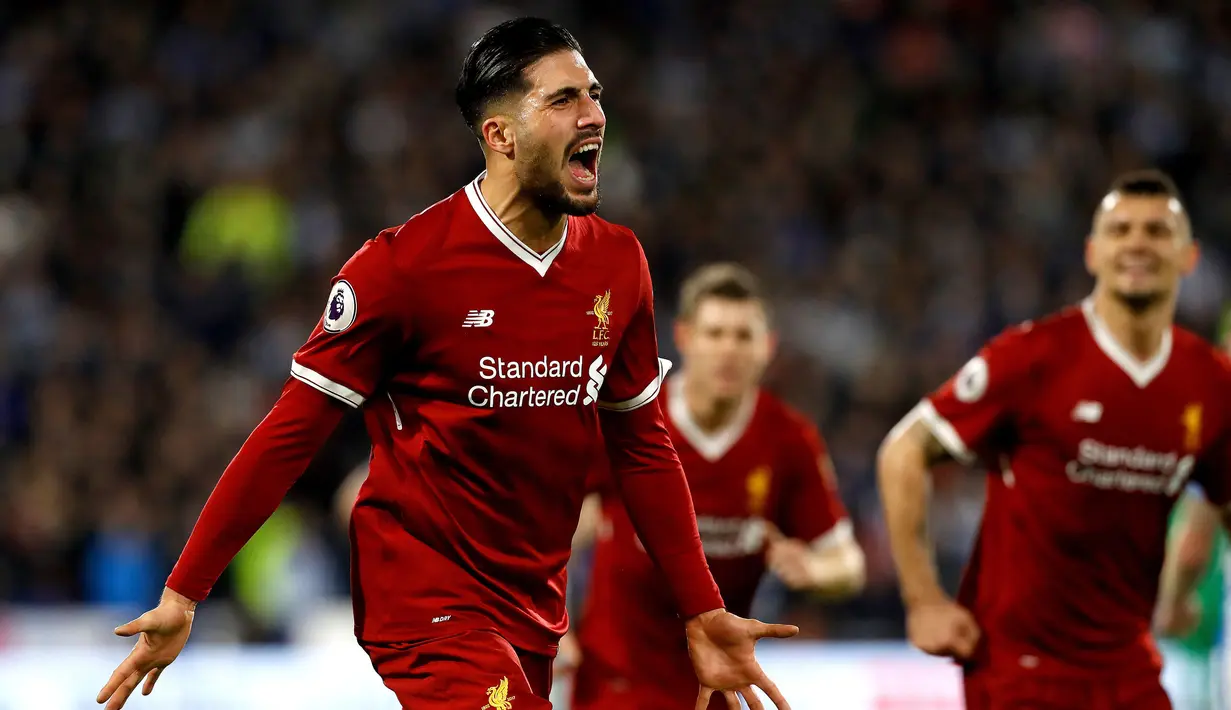 Pemain Liverpool, Emre Can berselebrasi setelah mencetak gol ke gawang Huddersfield Town pada pertandingan pekan ke-25 Premier League di John Smith's Stadium, Selasa (30/1). Liverpool menghempaskan Huddersfield Town 3-0. (Martin Rickett/PA via AP)