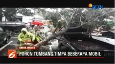 Cuaca buruk menyebabkan pohon tumbang dan menimpa sejumlah mobil di Ambon, Maluku, serta sejumlah jalan amblas.