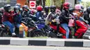 Sayangnya, jika tidak berhati-hati, pemudik yang menggunakan sepeda motor rawan kelelahan yang berujung pada kecelakaan. (Liputan6.com/Herman Zakharia)