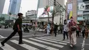 Para pekerja berjalan di jam pulang kantor di Kawasan Thamrin, Jakarta, Jumat (31/5/2024). (Liputan6.com/Angga Yuniar)