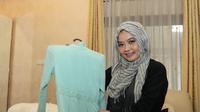 Untuk pernikahan Raka ini, istri Jokowi, Ibu Negara Iriana mempercayakan desain baju pengantin kepada desainer Tuty Adib. (Reza Kuncoro/Liputan6.com)