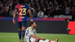Menjamu Benfica di Estadi Olimpic Lluis Companys, Barcelona sukses mengalahkan Benfica dengan skor 3-1. Kemenangan ini memastikan Barcelona lolos ke perempat final Liga Champions 2024/2025 dengan agregat 4-1 usai menang 1-0 di leg pertama dari Benfica. (Josep LAGO/AFP)