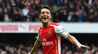 Gelandang Arsenal, Mesut Oezil. (AFP PHOTO / BEN STANSALL )