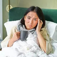 ilustrasi perempuan sakit/Mix and Match Studio/Shutterstock