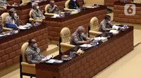 Menteri PUPR Basuki Hadimuljono (tengah) rapat kerja dengan Komisi V DPR RI di Senayan, Jakarta, Rabu (17/3/2021). Rapat membahas penanganan infrastruktur pascabencana dan pengembangan Food Estate dan Pembangunan Infrastruktur Ketahanan Pangan. (Liputan6.com/Angga Yuniar)