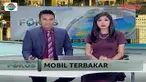 Sebuah angkutan umum terbakar di Palembang.