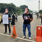 Aksi peringatan Hari Buruh di sekitar Patung Kuda, Jakarta, Sabtu (1/5/2021). (Liputan6.com/Ady Anugrahadi)