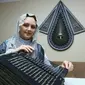 Seorang pelukis dan artis dekoratif dari Azerbaijan mendapat penghargaan internasional atas karya terbarunya, mentranskrip Al-Quran ke sutra