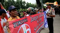 Aksi ratusan massa di depan gedung Balai Kota Jakarta pada Selasa 25 Maret 2014 mendapat kawalan ketat dari aparat kepolisian (Liputan6.com/Helmi Fithriansyah).