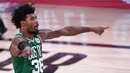 Pebasket Boston Celtics, Marcus Smart, melakukan selebrasi saat melawan Miami Heat pada pada gim ketiga final Wilayah Timur di Lake Buena Vista, Sabtu (19/9.2020). Boston Celtics menang dengan skor 117-106. (AP/Mark J. Terrill)