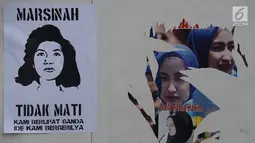 Selebaran tentang pejuang buruh Marsinah tertempel saat Buruh Internasional atau May Day di kawasan Bundaran HI, Jakarta, Rabu (1/5/2019). Buruh yang melakukan demo pada tahun ini memiliki berbagai tuntutan kepada pemerintah. (merdeka.com/Imam Buhori)