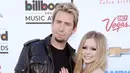 Kontan foto yang Avril Lavigne unggah tersebut menimbulkan komentar beragam, Ada yang mempertanyakan status hubungan mereka. Karena hubungan mereka memang di mulai dari berkarya di dunia musik. (AFP/Bintang.com)