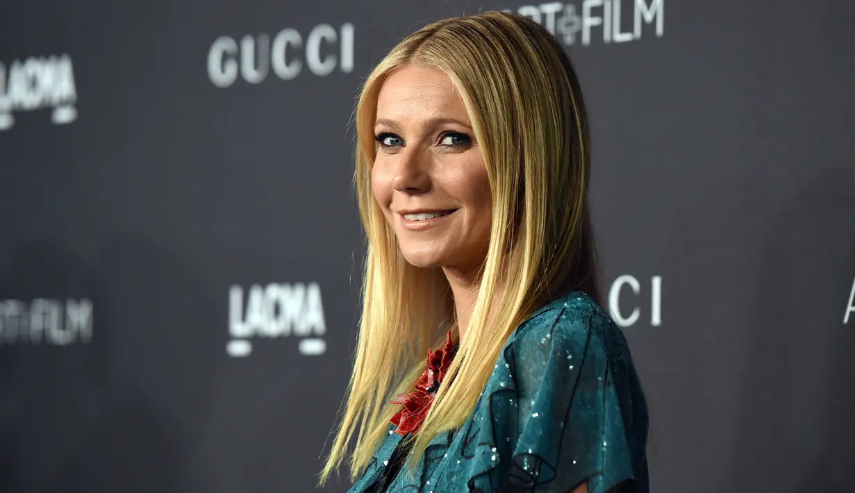 Rambut pirang dan senyumnya yang manis membuat Gwyneth Paltrow sukses meraih status sebagai wanita tercantik dunia versi majalah People pada 2013.  Wanita 43 tahun itu tak sekedar cantik, namun juga sangat elegan dan matang secara emosional. (AFP Photo)