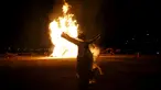 Penari beratraksi di depan bakaran api saat jelang perayaan "Jeongwol Daeboreum" di Seoul, Korea Selatan, Minggu (21/2). Tradisi perayaan "Jeongwol Daeboreum" ini merupakan bagian dari peringatan hari besar dalam penanggalan Imlek. (REUTERS/Kim Hong-Ji)