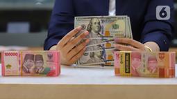 Mengutip data Bloomberg per Rabu (26/6/2024) pukul 15.00 WIB, rupiah ditutup melemah 0,23% ke Rp16.413 per dolar AS. (Liputan6.com/Angga Yuniar)