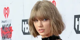 Kini, Taylor Swift masih menjadi pusat perhatian publik tentang hubungan asmaranya dengan aktor tampan asal Inggris, Tom Hiddleston. (AFP/Bintang.com)