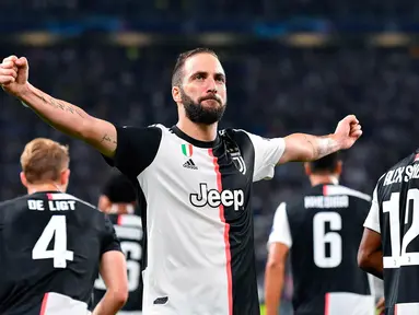 Pemain Juventus Gonzalo Higuain melakukan selebrasi usai mencetak gol ke gawang Bayer Leverkusen pada matchday kedua Liga Champions di Allianz Stadium, Turin, Italia, Selasa (1/10/2019). Juventus menghajar Bayer Leverkusen 3-0. (Alessandro Di Marco/ANSA via AP)